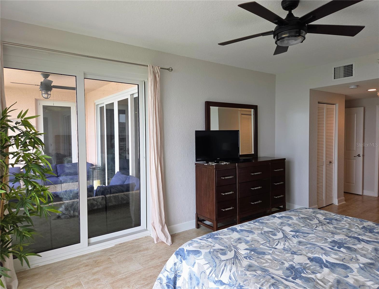 Master Bedroom with Sliders to Balcony
