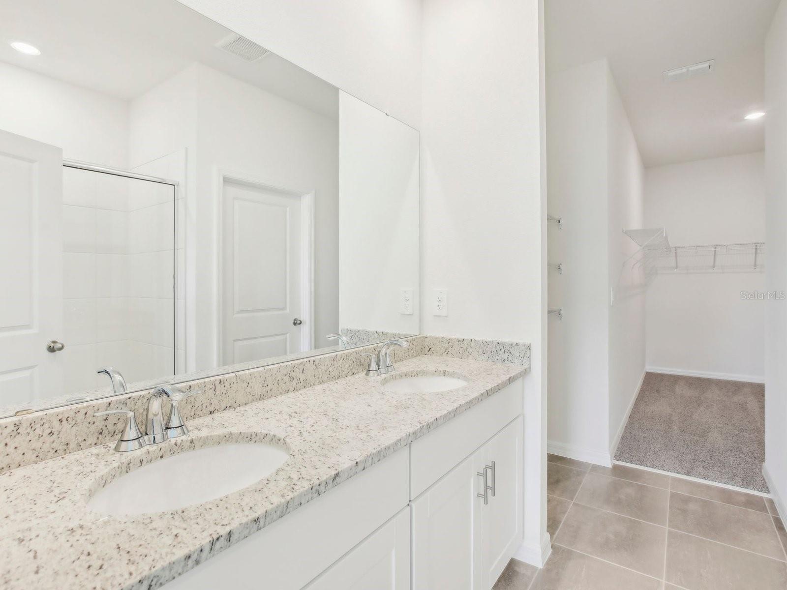 Interior photos are not of the actual home but are photos of the builder home with same floorplan with similar interior finishes and features.