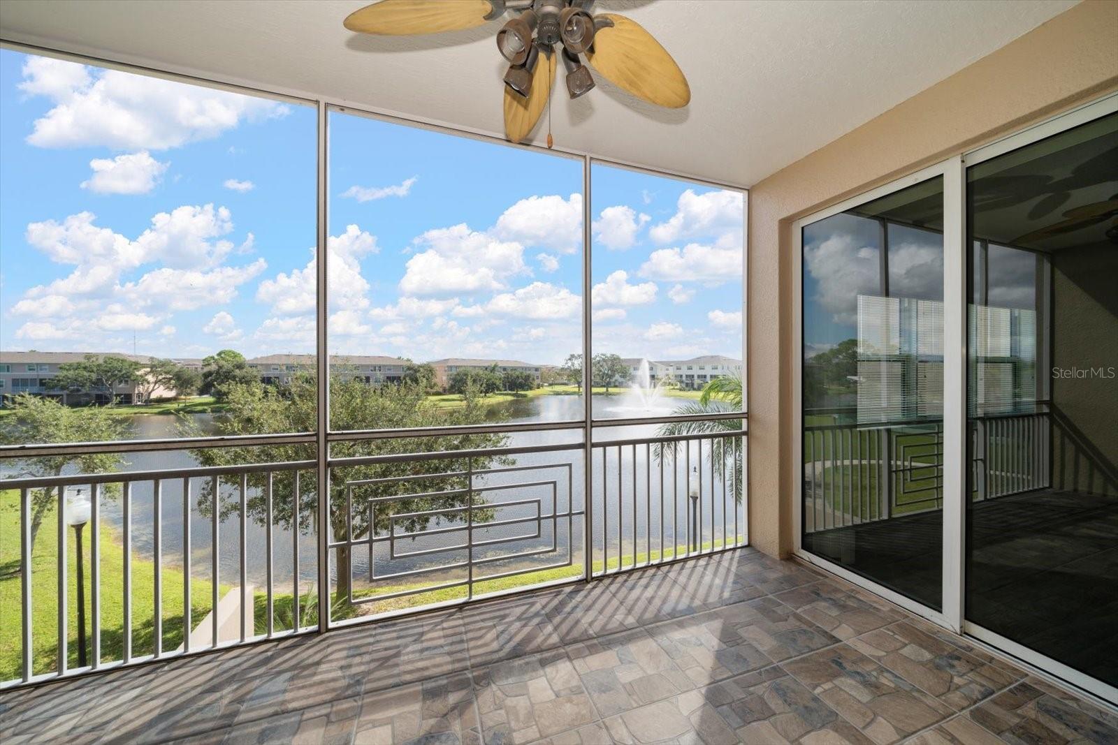 Balcony overlooks lake with fountain