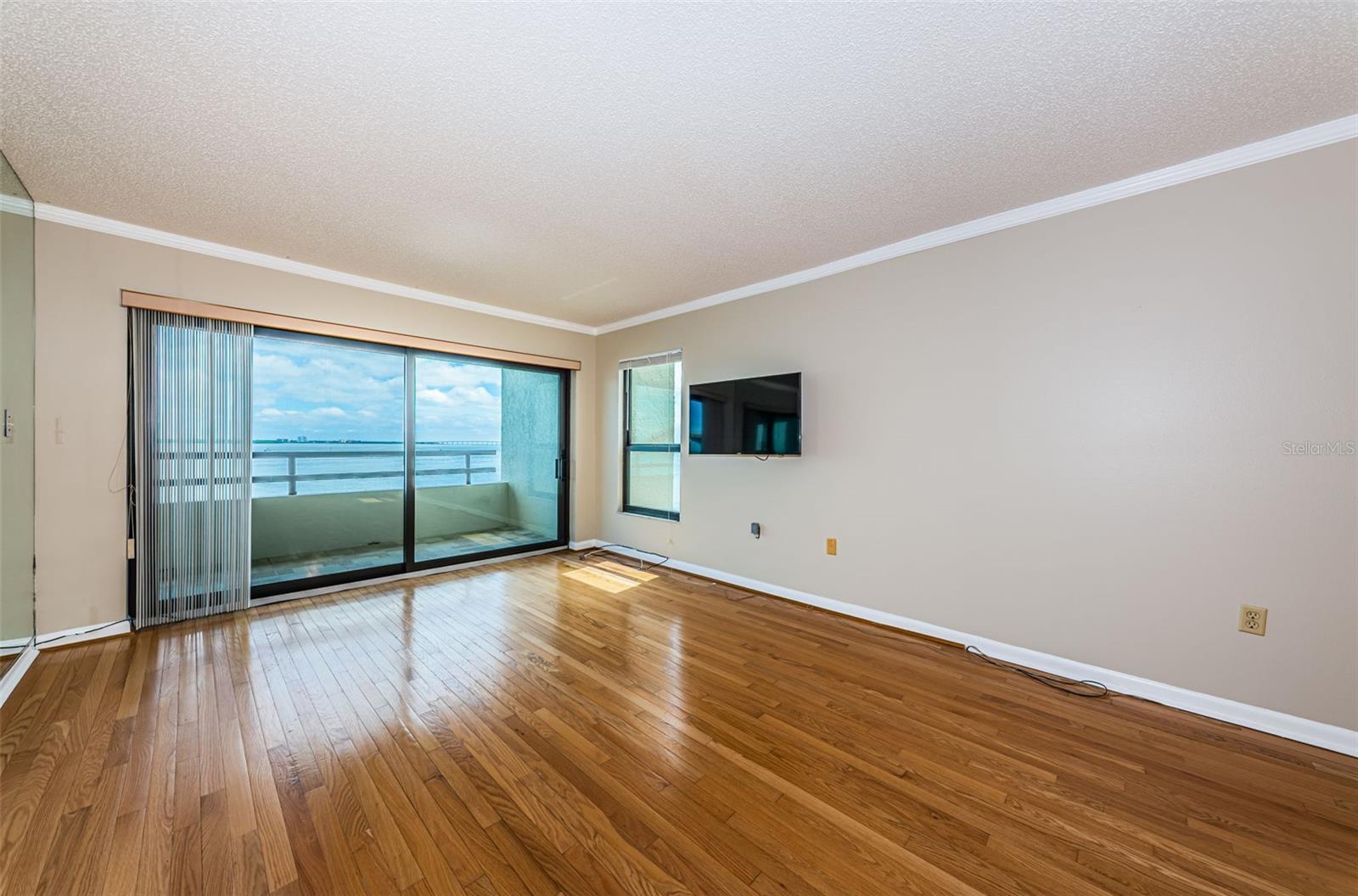 Main Living Area has hurricane impact sliding doors that open to the 21' Balcony overlooking the Bay