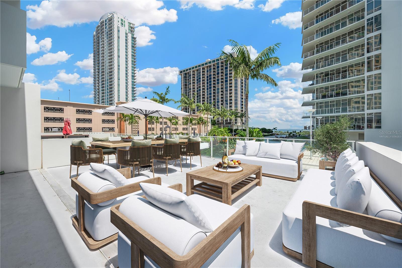 Virtually Staged - View of Private Deck Overlooking Pool/Amenities and Bay View