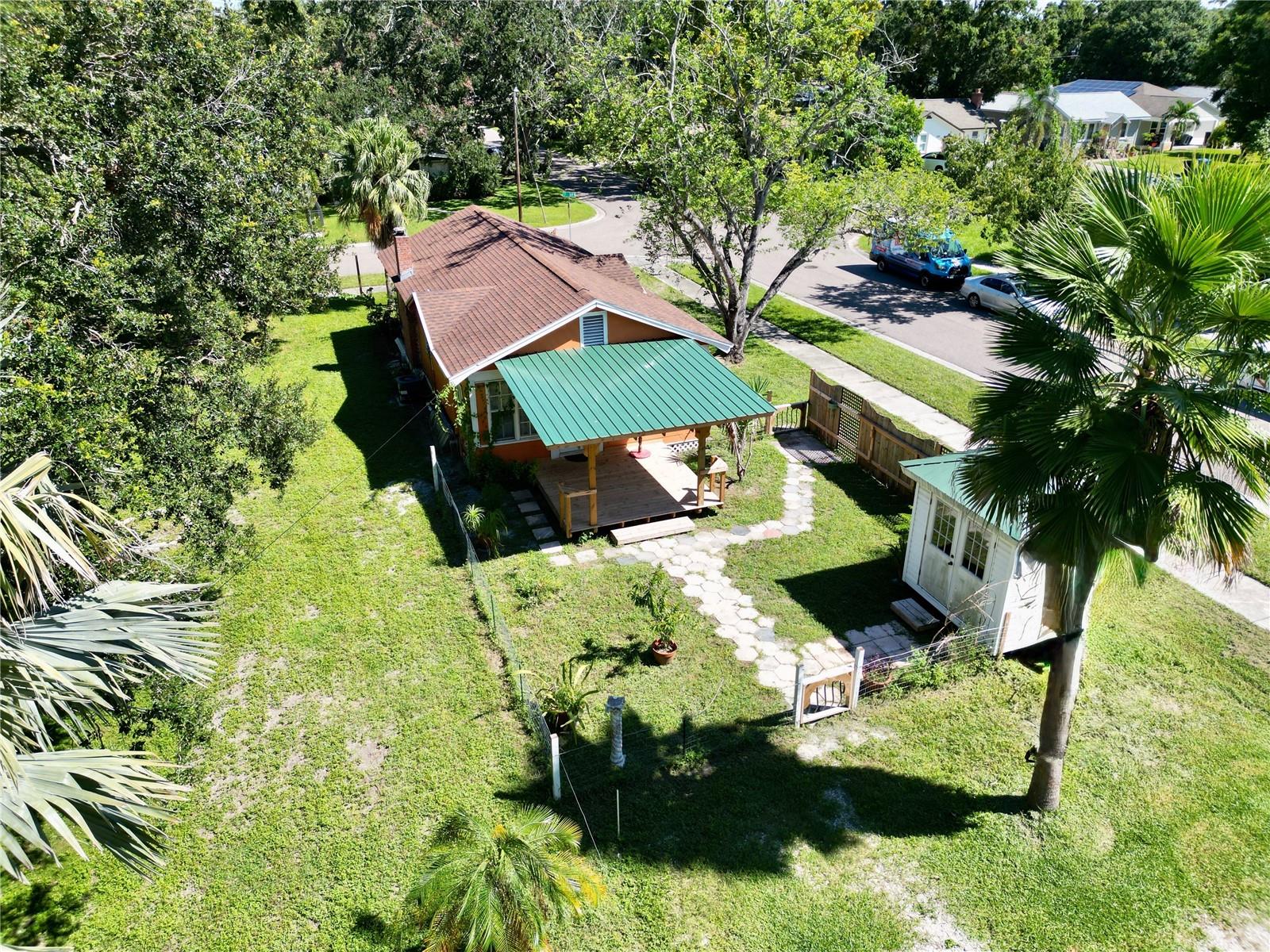 Back of the property with parking area outside the fence.