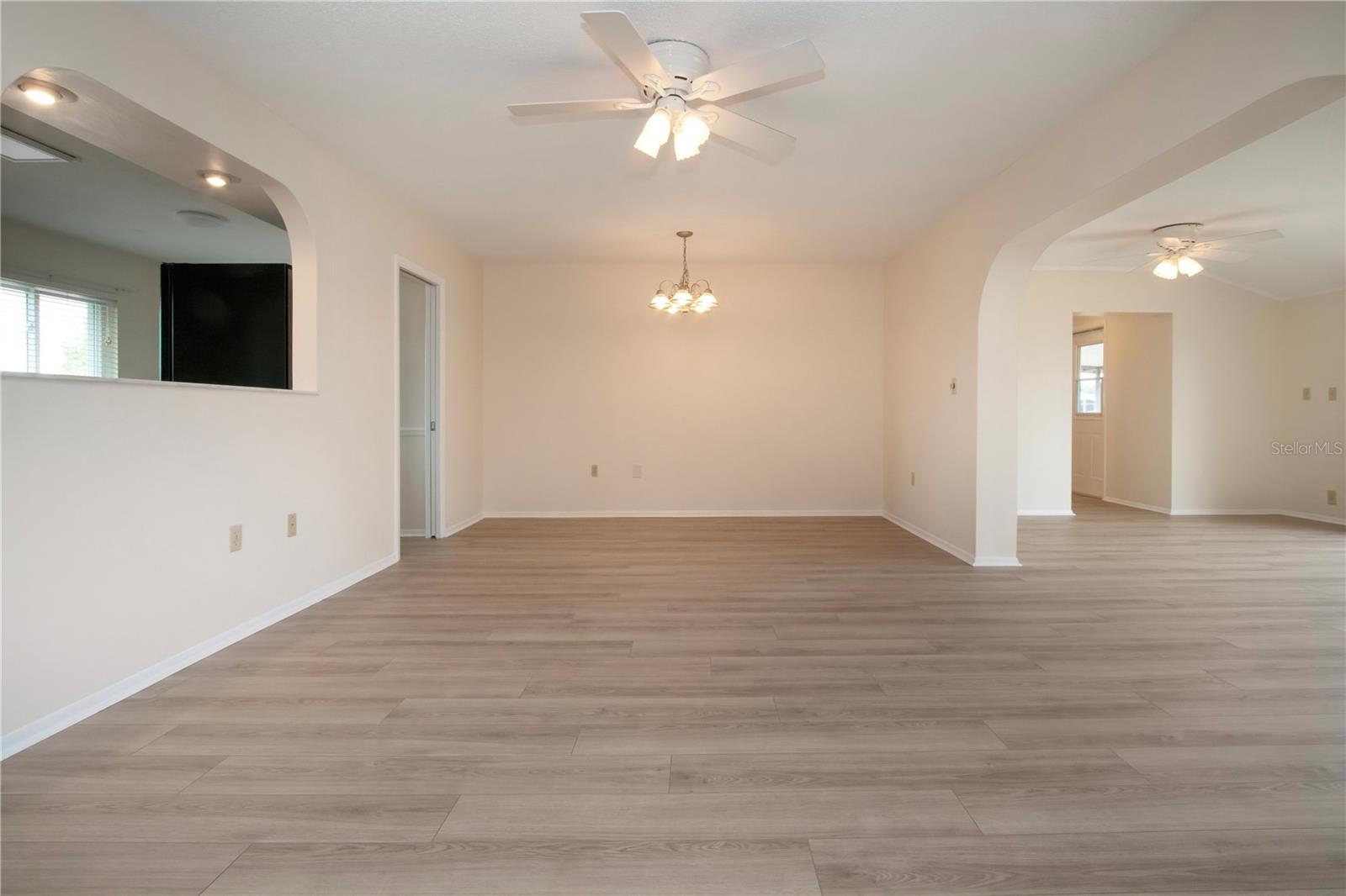 Living room/dining room with pass through window from kitchen