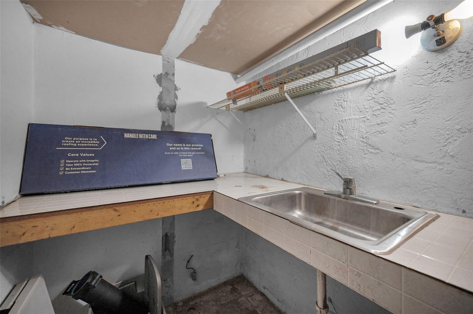 was once a shower, sink toilet, was changed to be a darkroom.