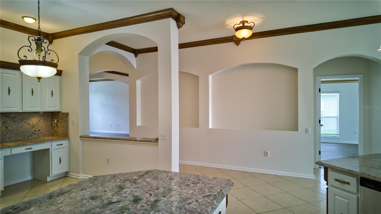 Built In Desk with passthrough and wall niches for your favorite art pieces