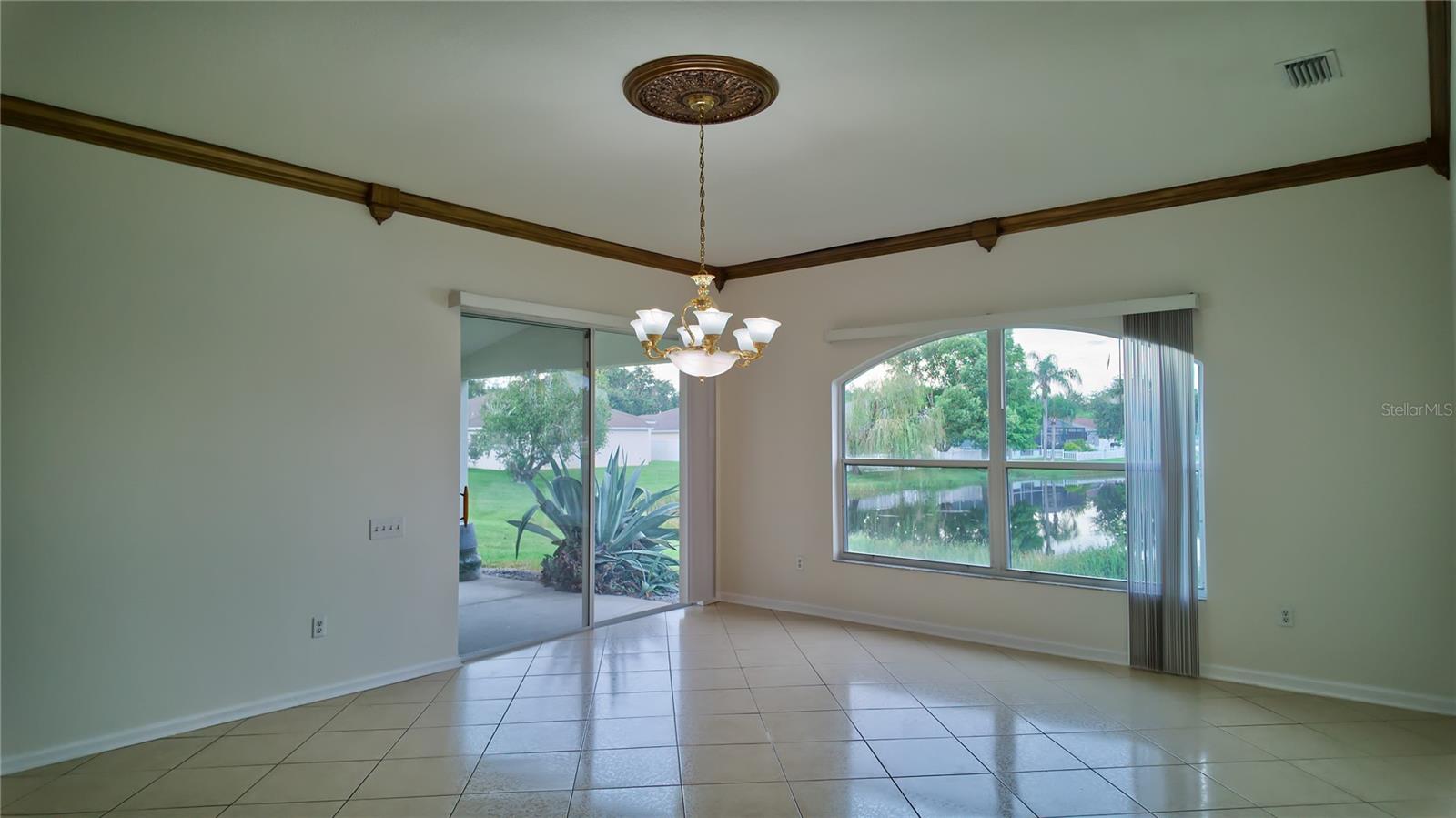 Enjoy the view from the large window and patio sliders