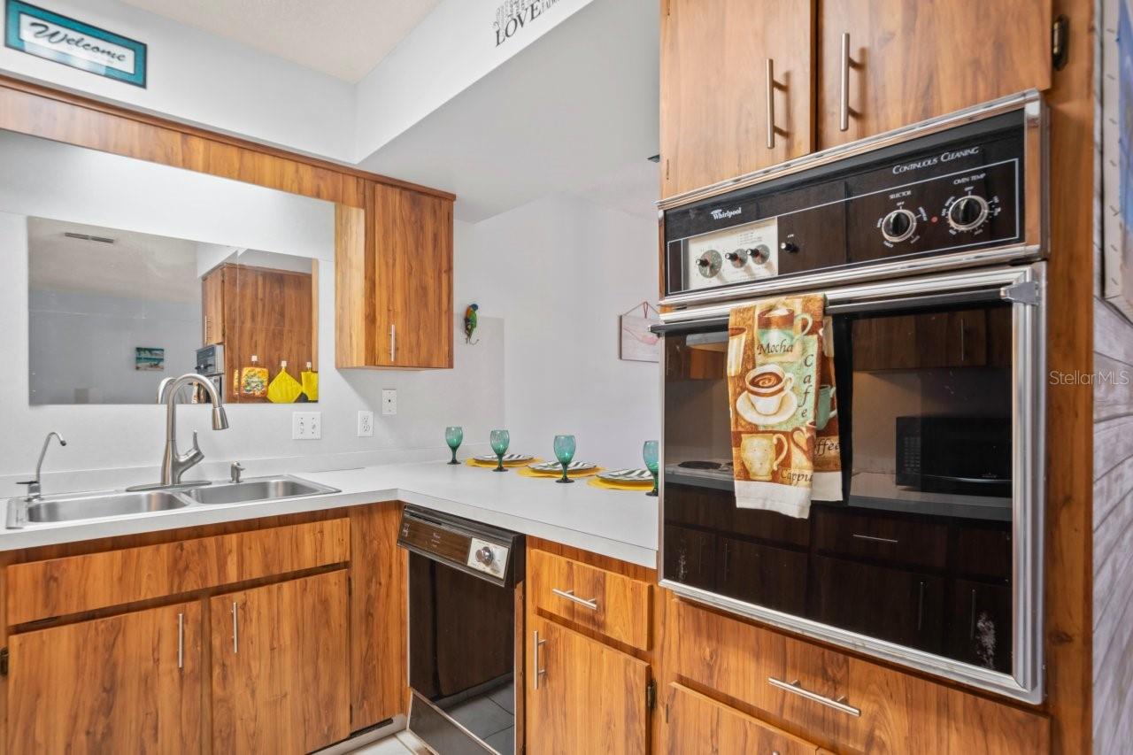 Features wall oven, dishwasher, double stainless-steel sink with hot water dispenser and soap dispenser