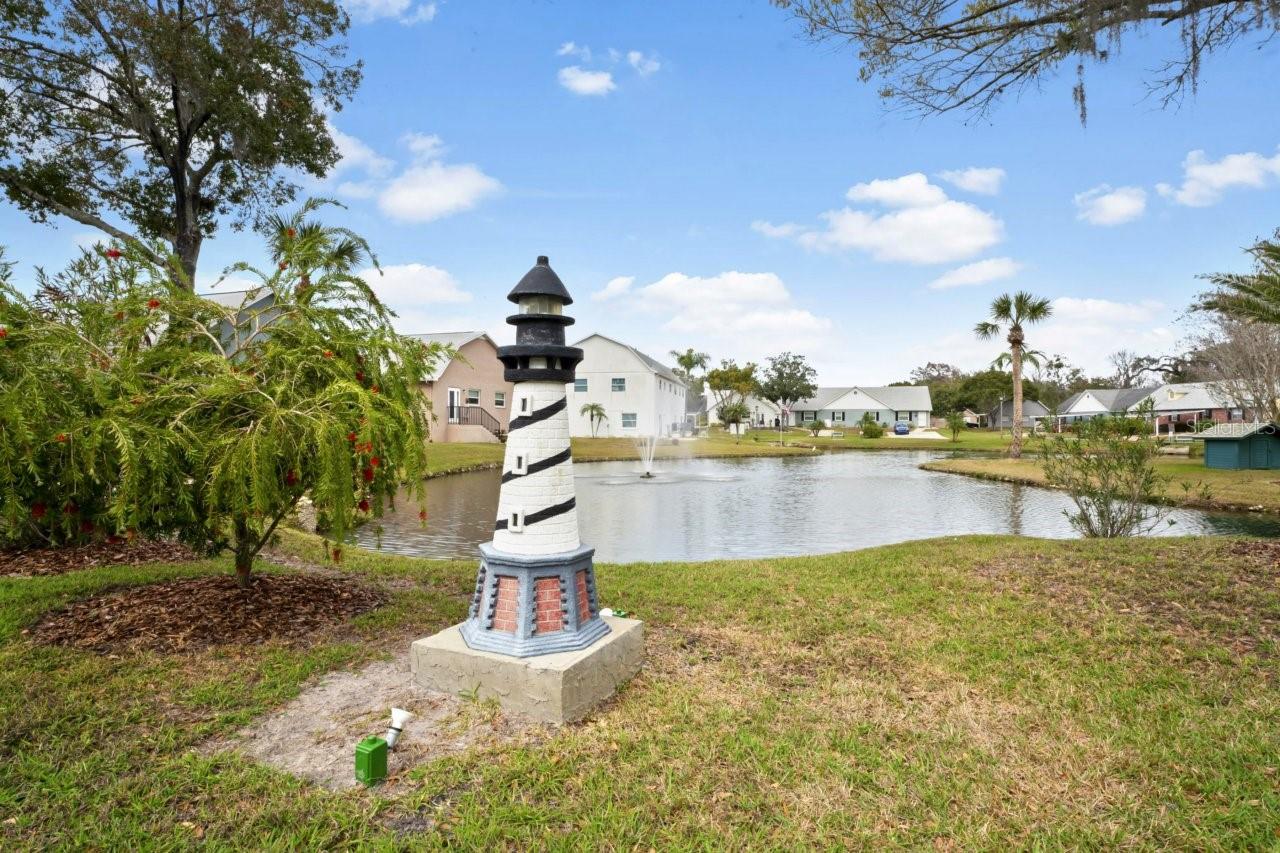 Quaint lighthouse and pond