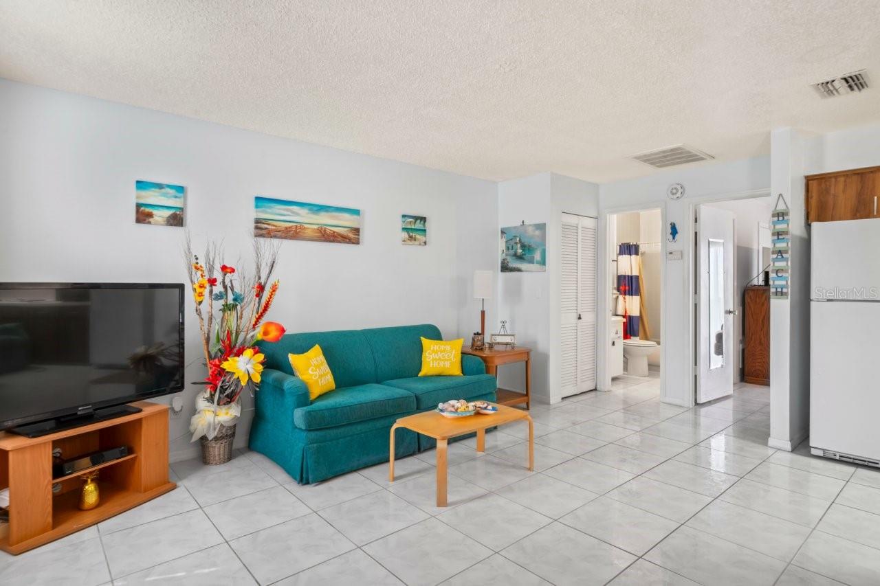 Living room has ceramic tile flooring