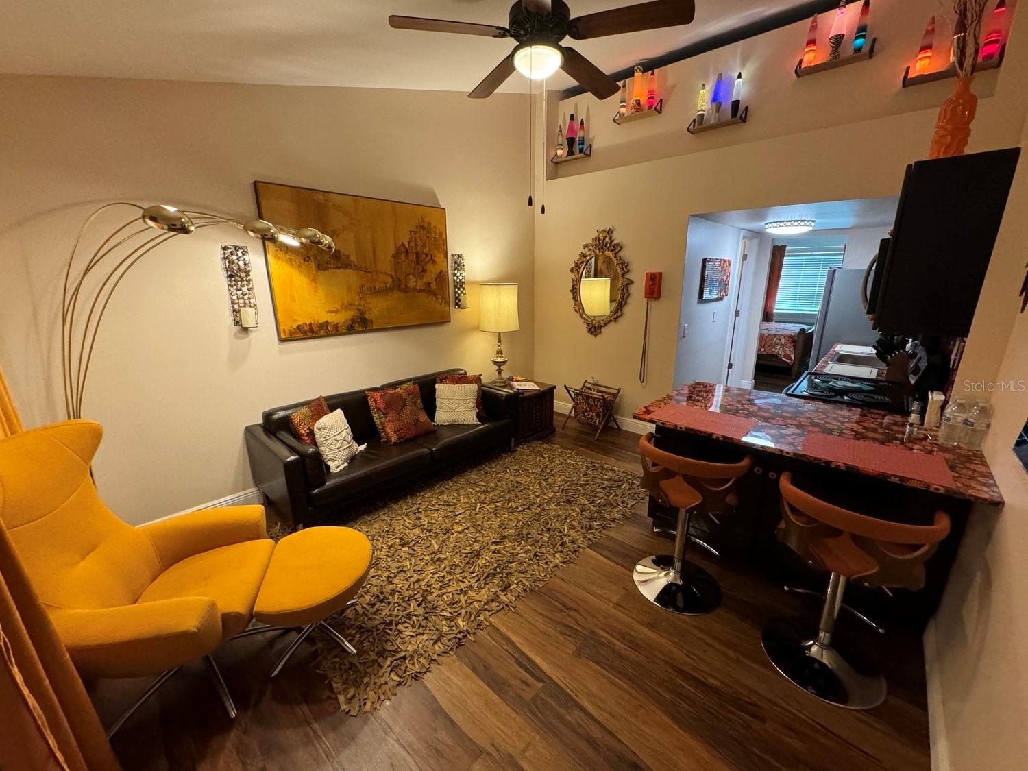 Living Room with Lava Lamp wall