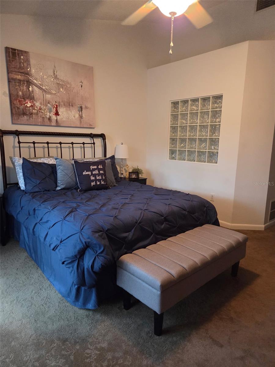 Primary Bedroom with cathederal ceilings.