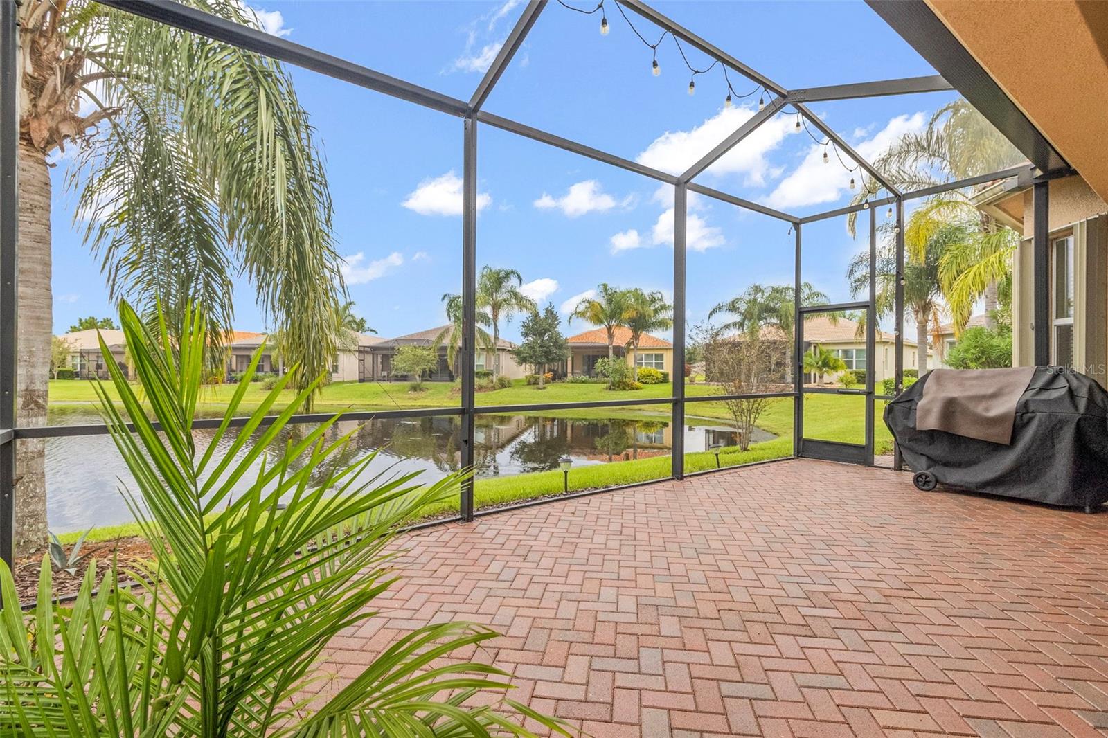 Extended Screen Enclosed Lanai with view of Lake & Sunset