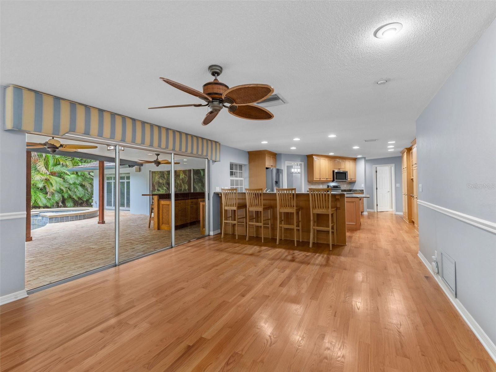 Enjoy the open layout with a view of the kitchen and casual bar seating