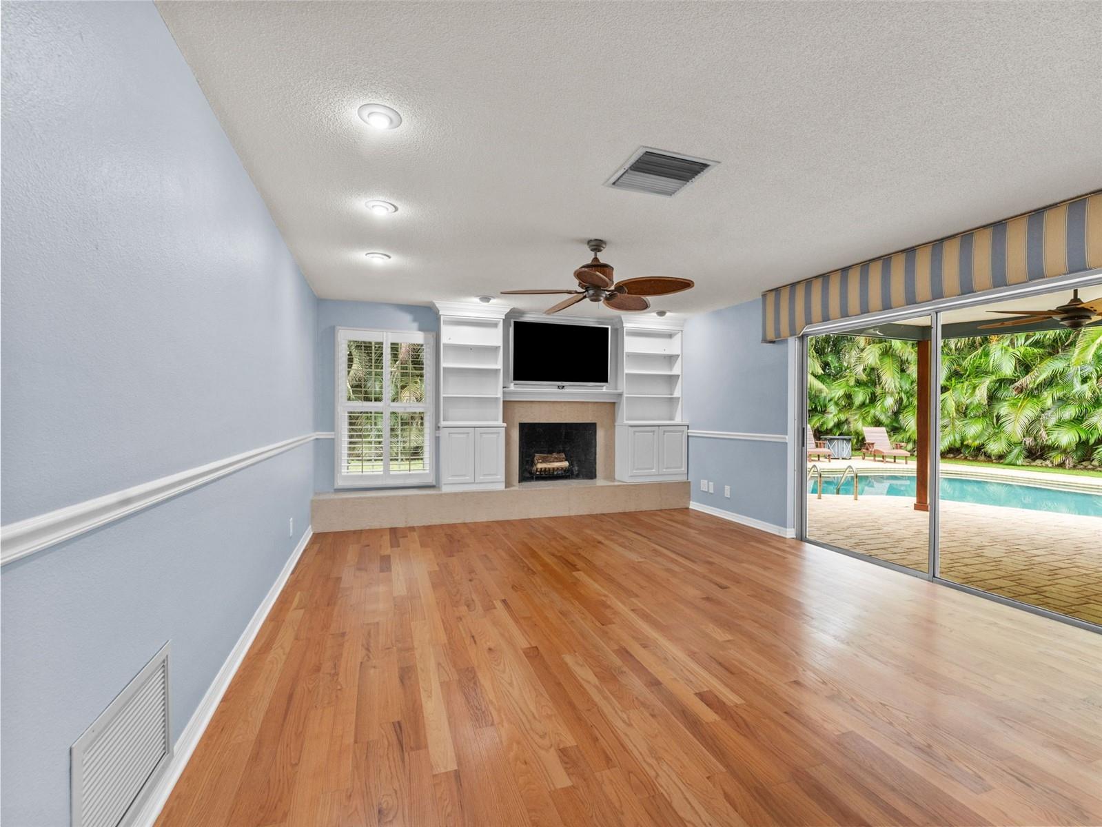 Bright family room with abundant natural light and built-in storage