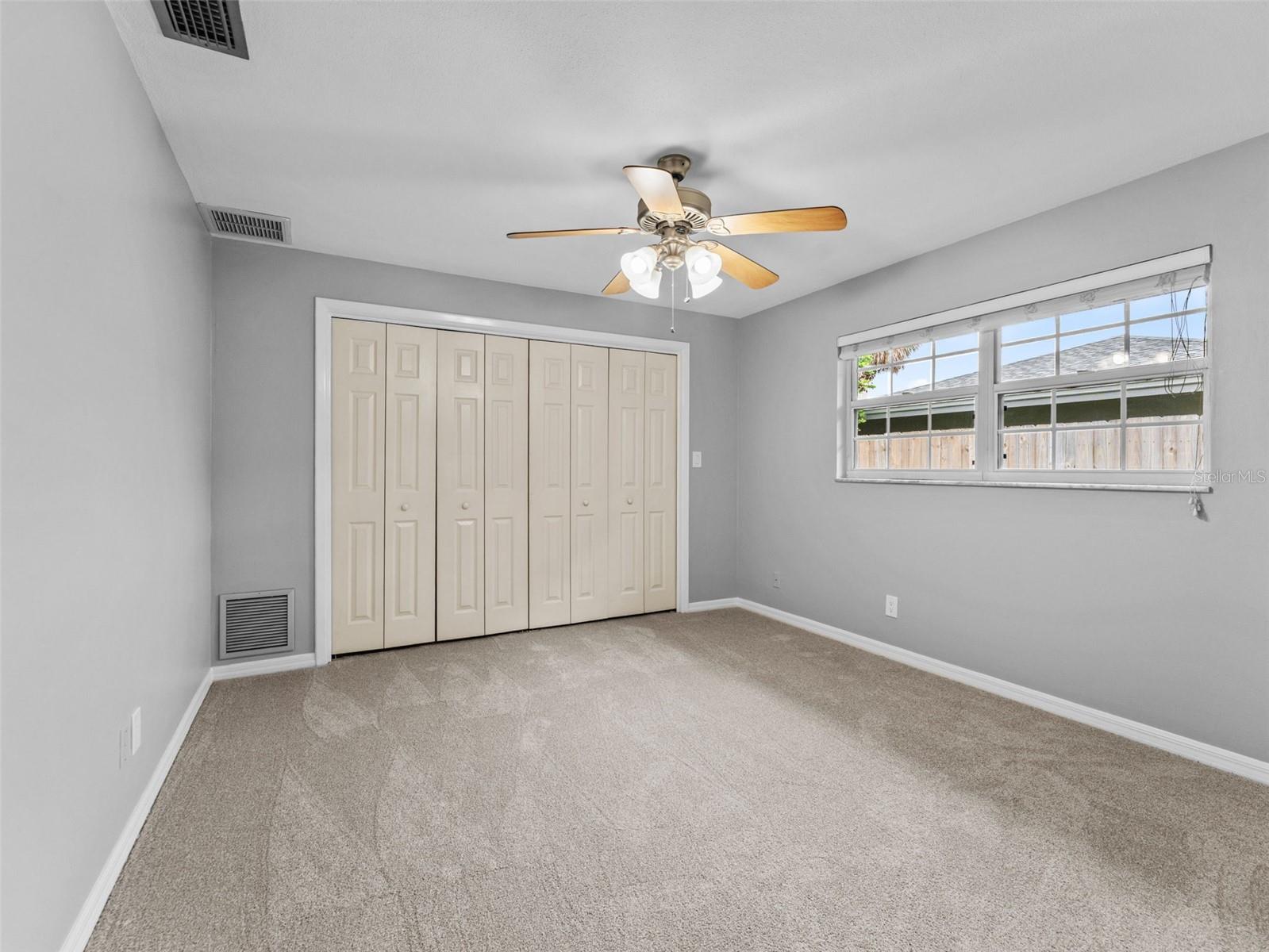 Spacious Bedroom 3 with brand-new plush carpet