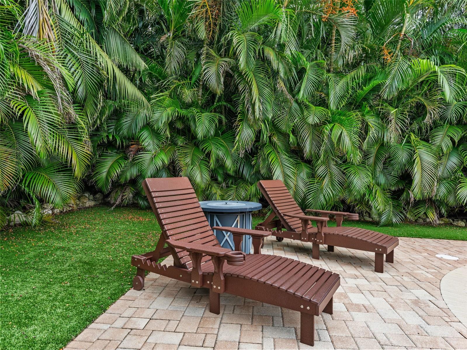 Low-maintenance turf surrounds the pool, creating a clean and green oasis