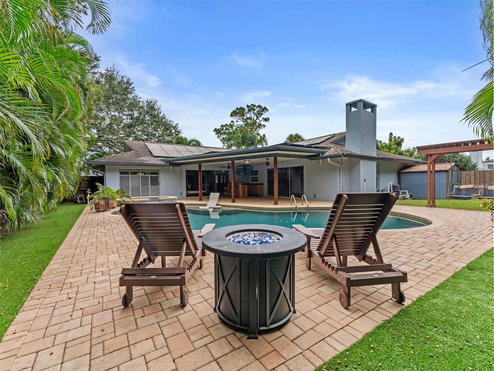 Relax in style on the lounge chairs surrounding the gorgeous pool