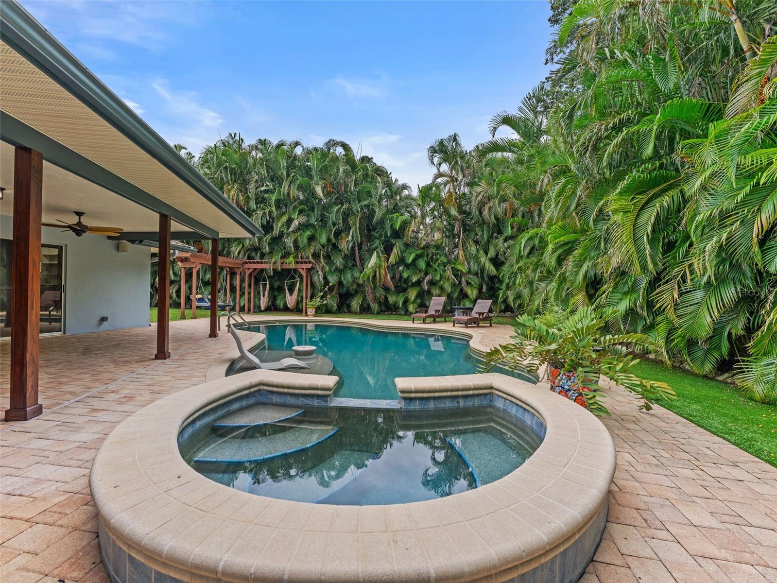 Relax and unwind in the sparkling pool with a heated spa