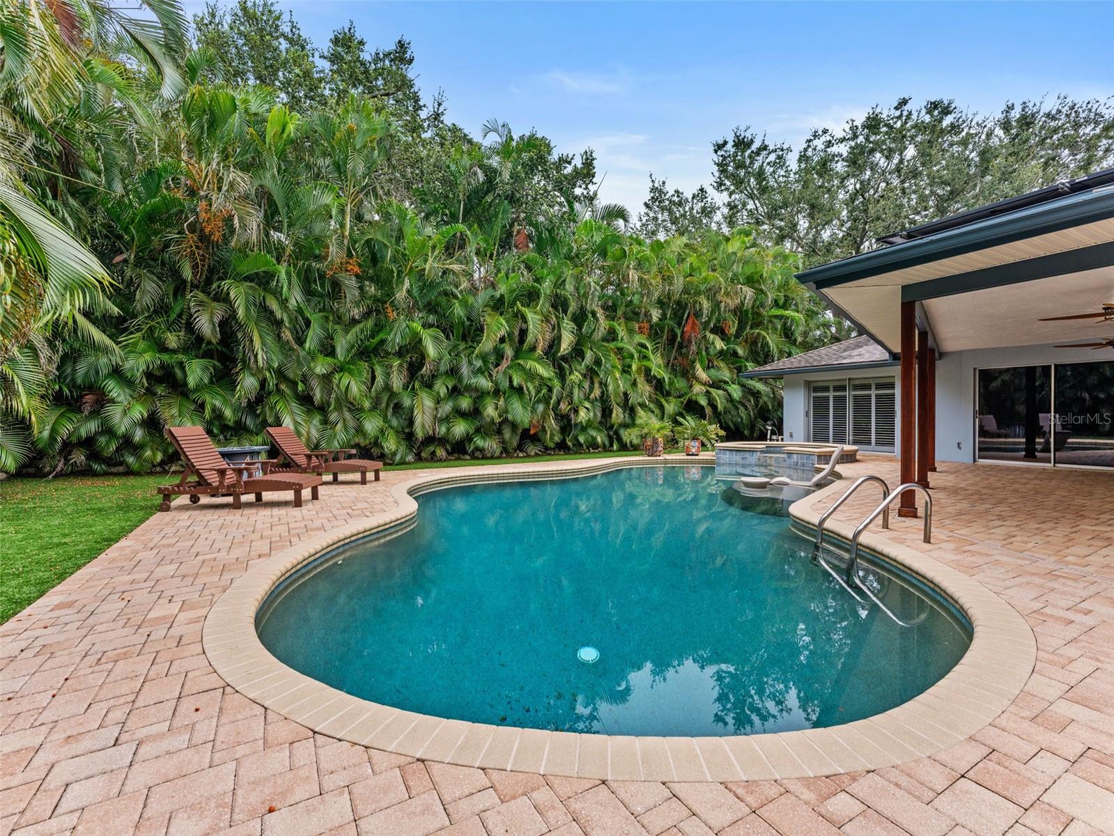 Spacious pool with a luxurious PebbleTec finish for elegance and durability