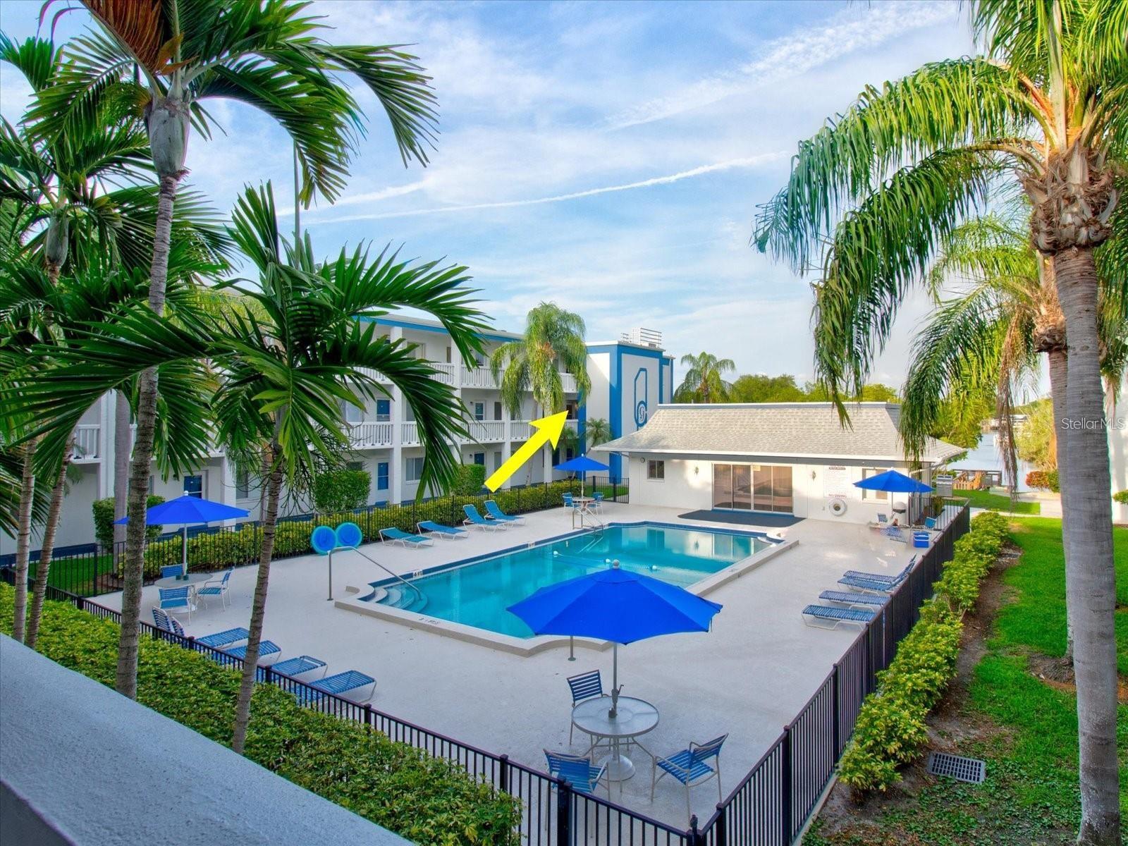 Pool, canal, clubhouse, and grill below