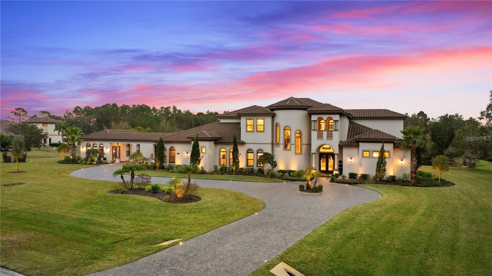 Stonelake Ranch, an Exclusive Gated Community. This 5.5 acre estate is nestled next to a beautiful creek lined by oak trees this home backs up to a pond and acres of conservation for extensive privacy.