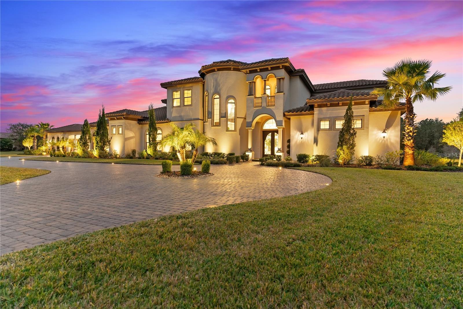 Multi-Generational and Modern Mediterranean Estate with Detached In-Law Suite. Offering over 8,100 heated square feet and four bedrooms suites on the first floor.