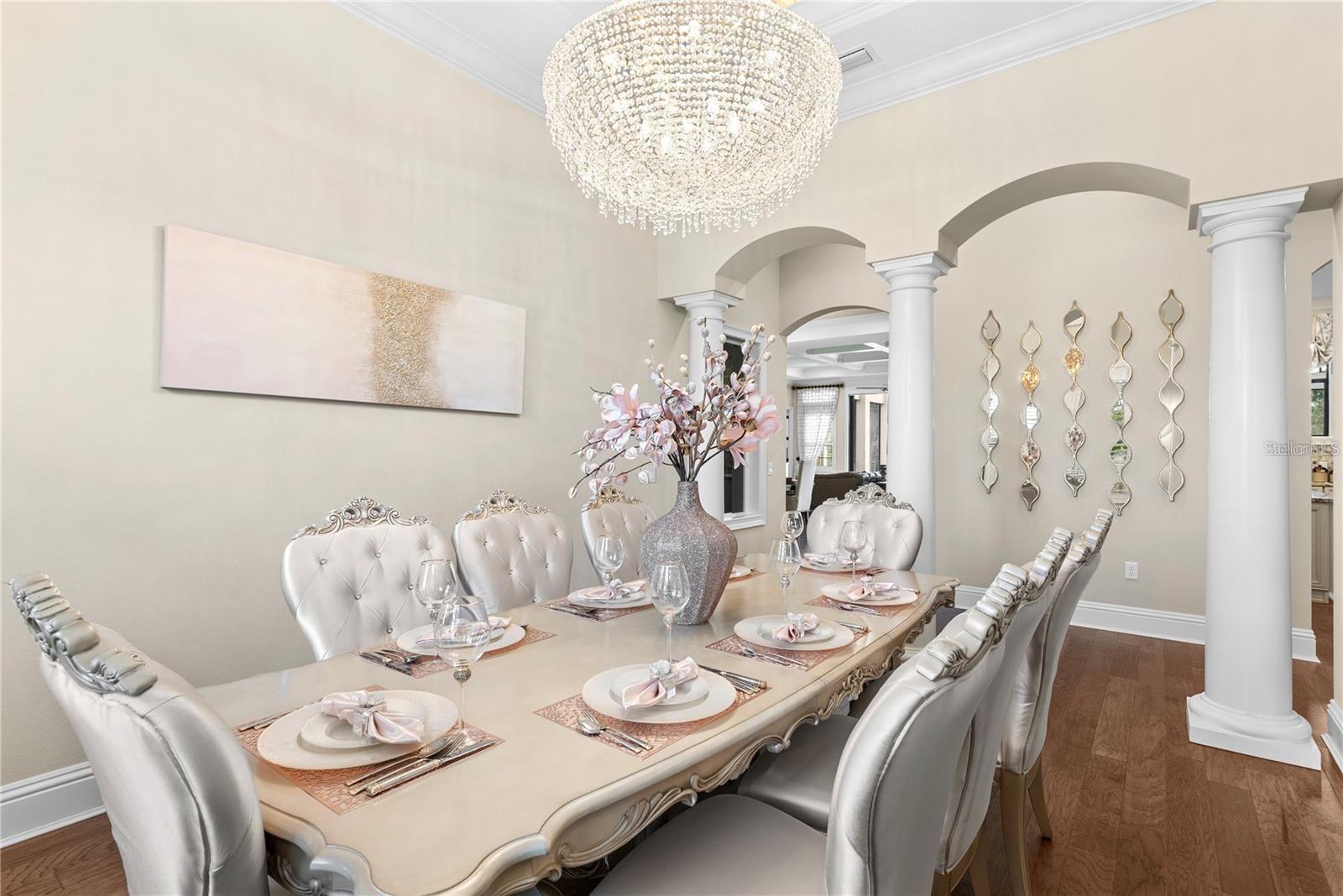 The elegant formal dining room is designed for grand gatherings, featuring a spacious layout perfect for hosting.