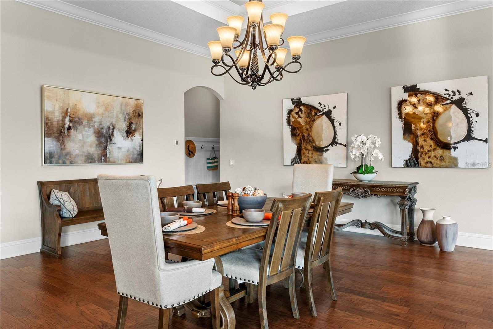 The downstairs showcases a convenient elevator and a well-appointed mudroom, seamlessly blending functionality with refined design.