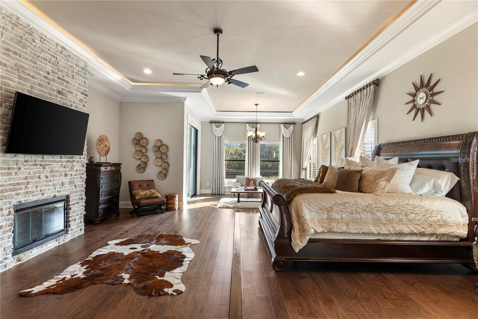 The owner’s suite also boasts a private fireplace, elegant step-up design, and direct access to the resort-style pool, creating a perfect blend of luxury and tranquility.