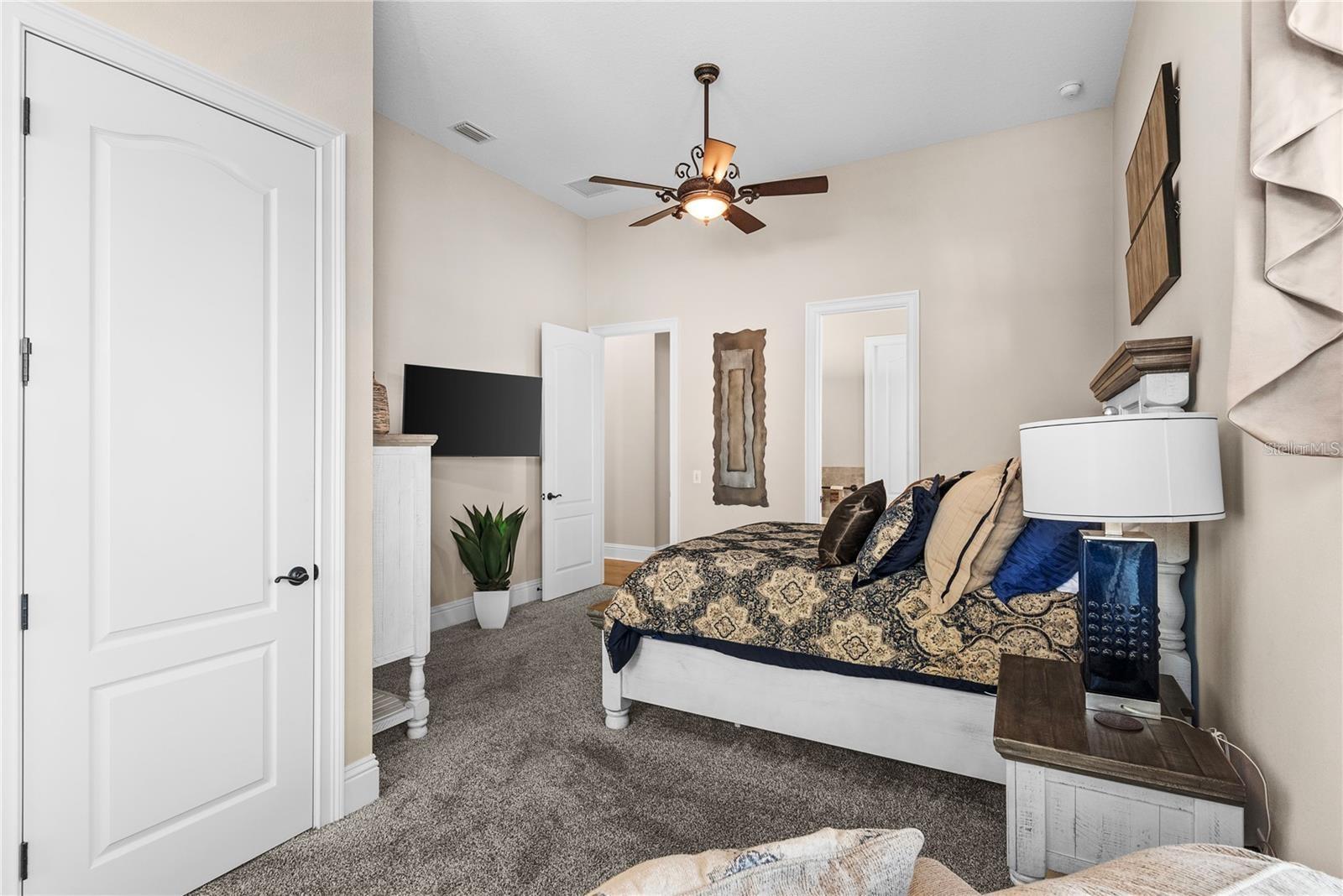 This thoughtfully located first-floor bedroom includes access to the shared Jack-and-Jill bathroom. Conveniently positioned close to the elevator, mudroom, and garage for seamless functionality.
