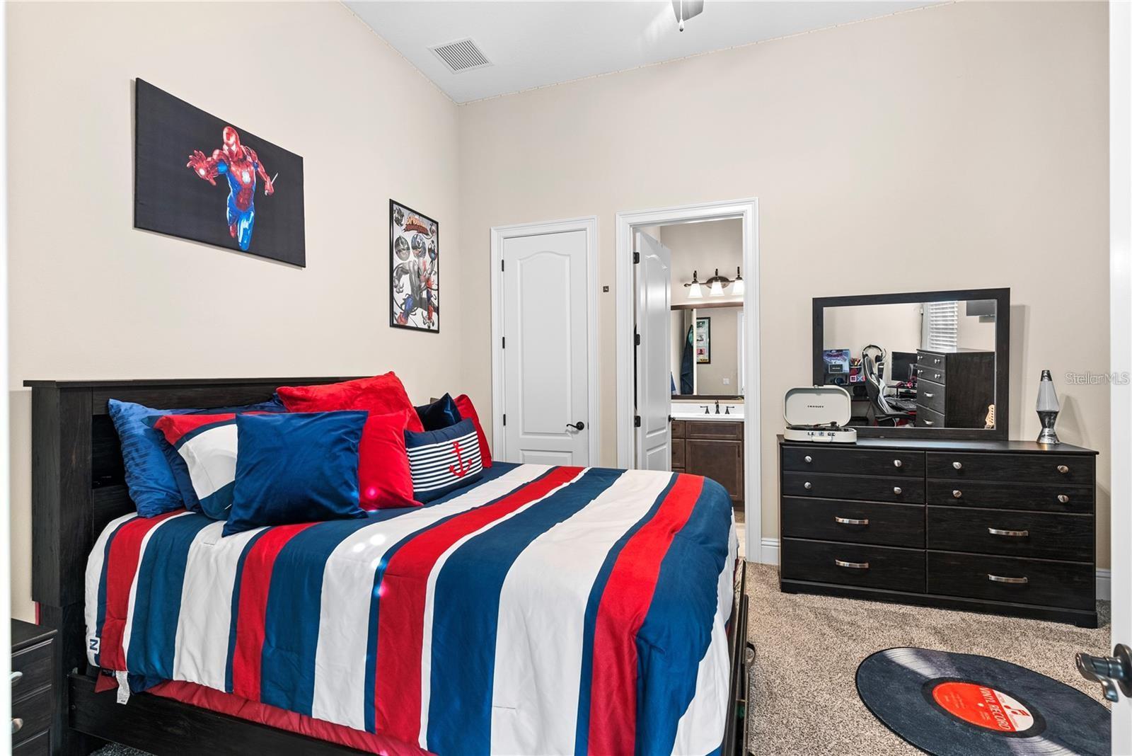 TThis first-floor bedroom includes an ensuite bathroom and walk-in closet.