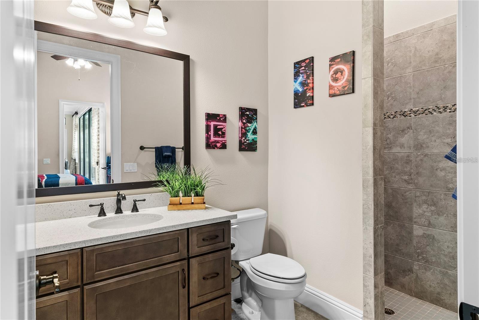 Full bath with walk in shower.