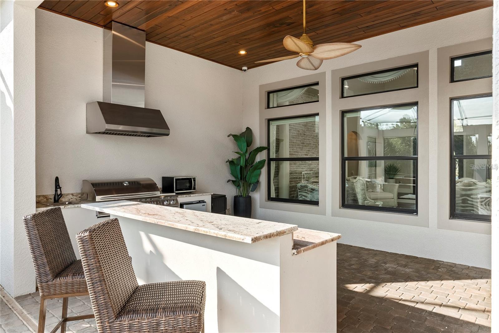 Resort-style pool and outdoor entertainment spaces.