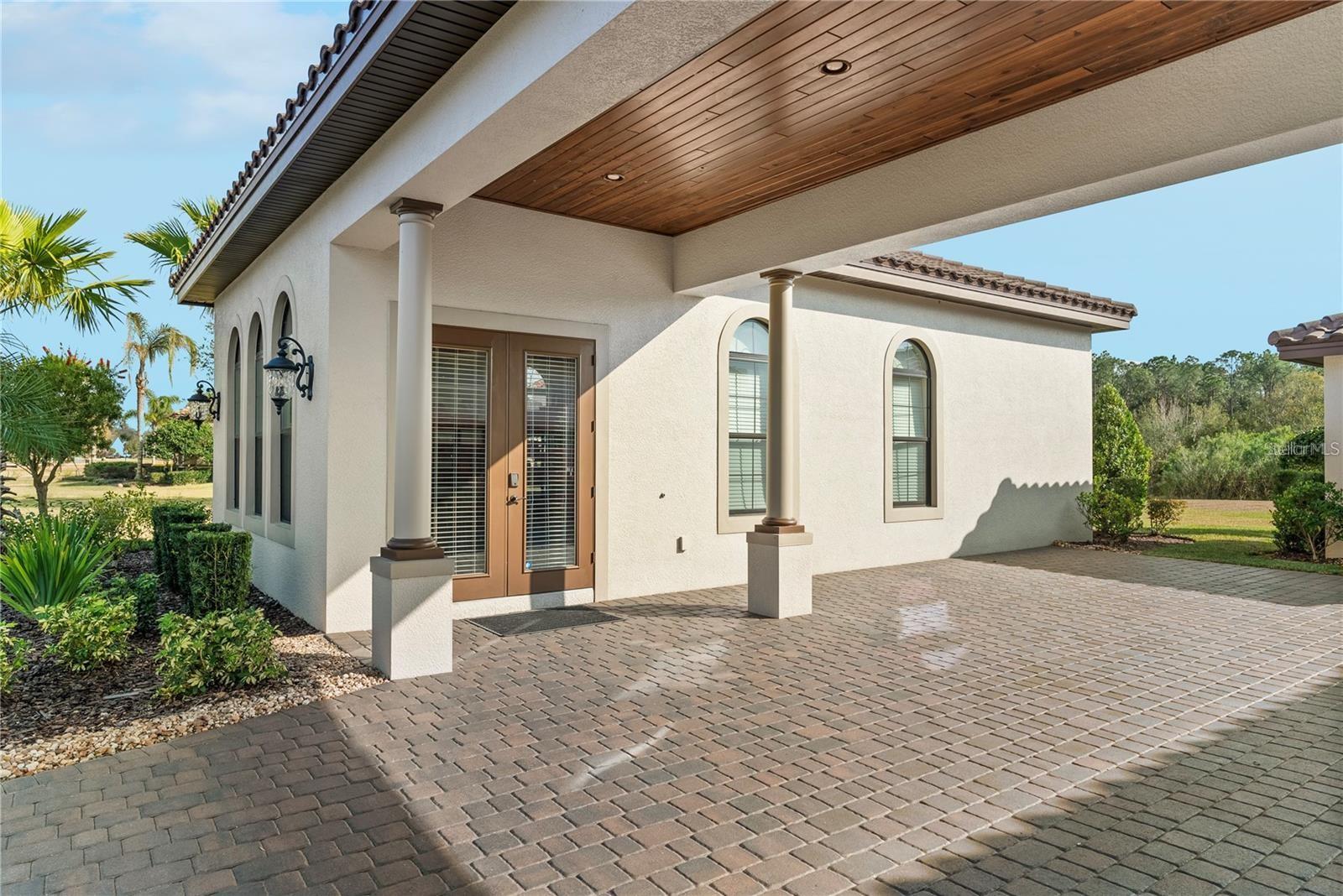 Enhancing the estate's functionality is a detached office space, accessed via a porte-cochère.