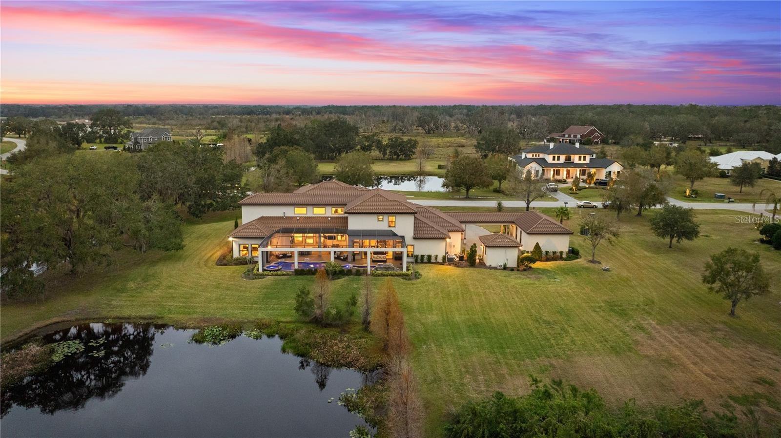 Nestled next to a beautiful creek lined by oak trees this home backs up to a pond and acres of conservation for extensive privacy.