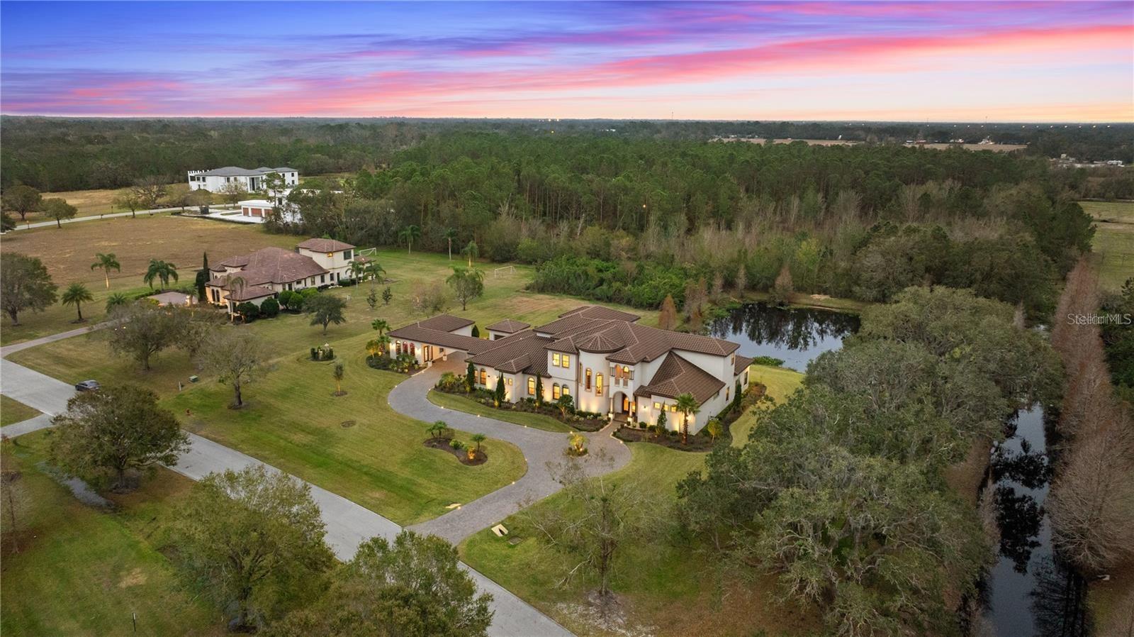 Outdoor enthusiasts will love the estate’s private pond and serene conservation views.
