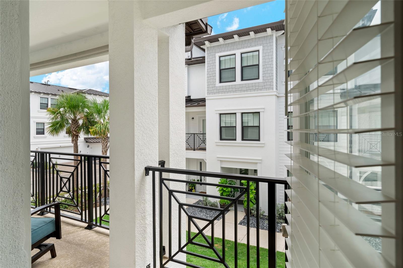 Expansive second-level balcony overlooking front of the property.