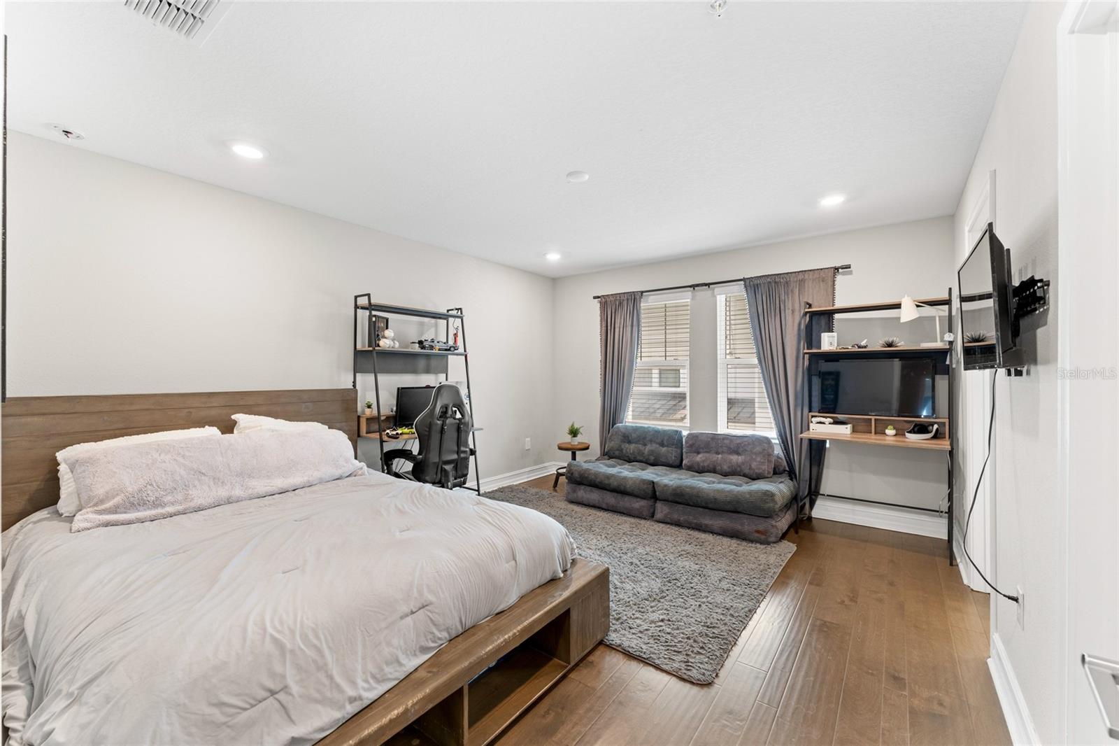Upper level bedroom with walk-in closet.