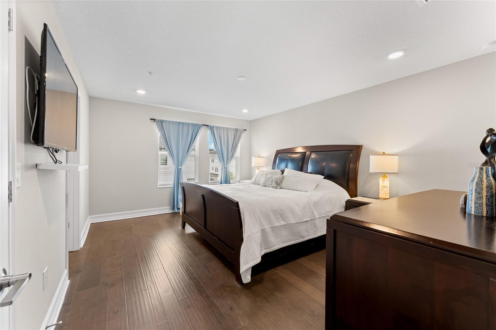 Upper-level primary bedroom with large walk-in closet.