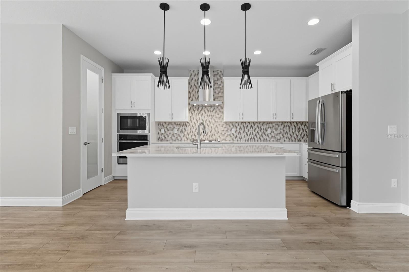 Massive Quarts Counters with breakfast bar
