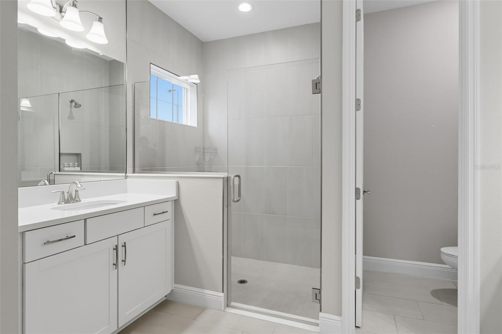 His and Her vanities in spacious master bath