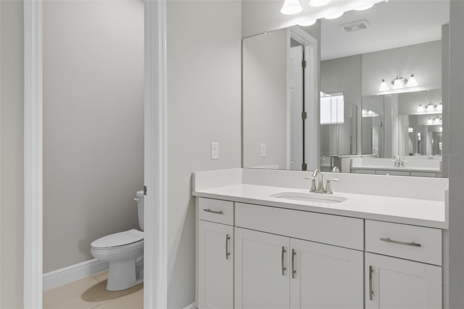 His and Her vanities in spacious master bath