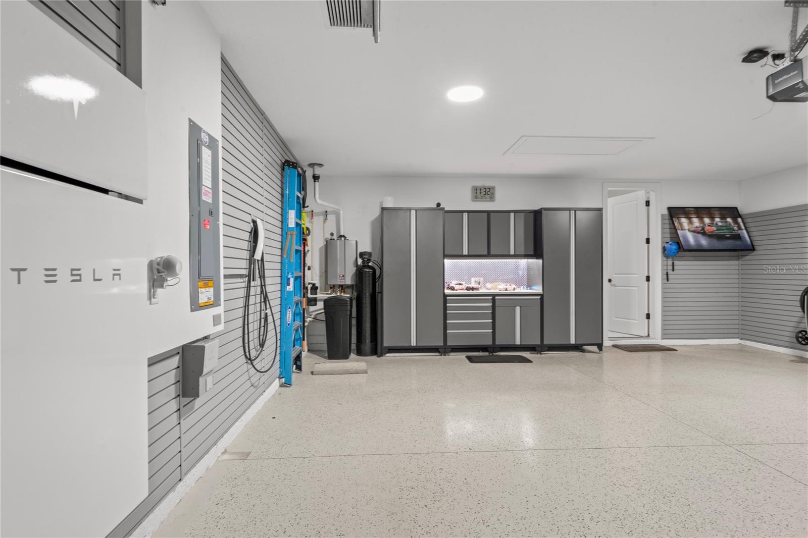 Garage epoxy flooring and storage cabinets