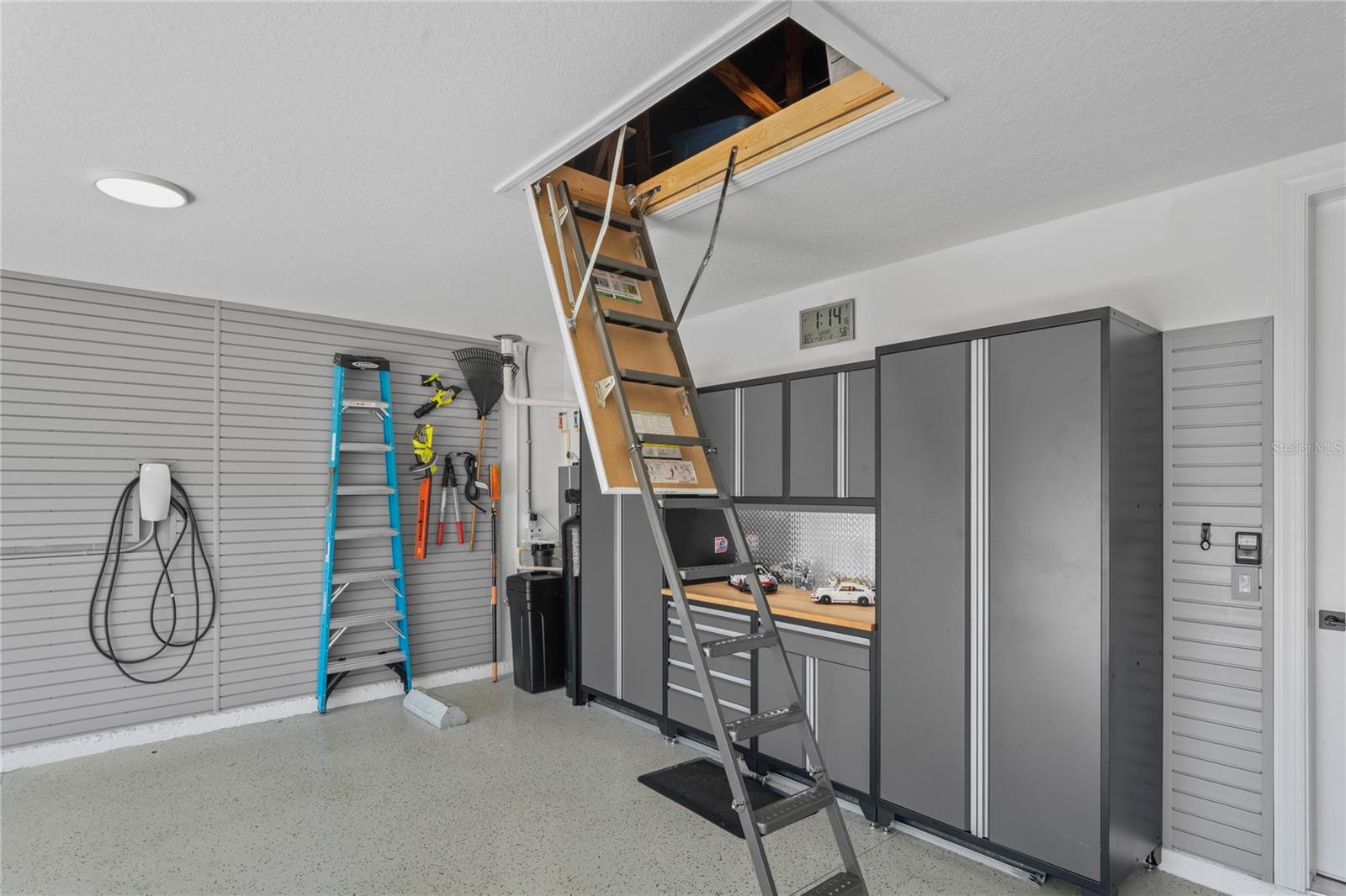 Attic with steel foldable ladder