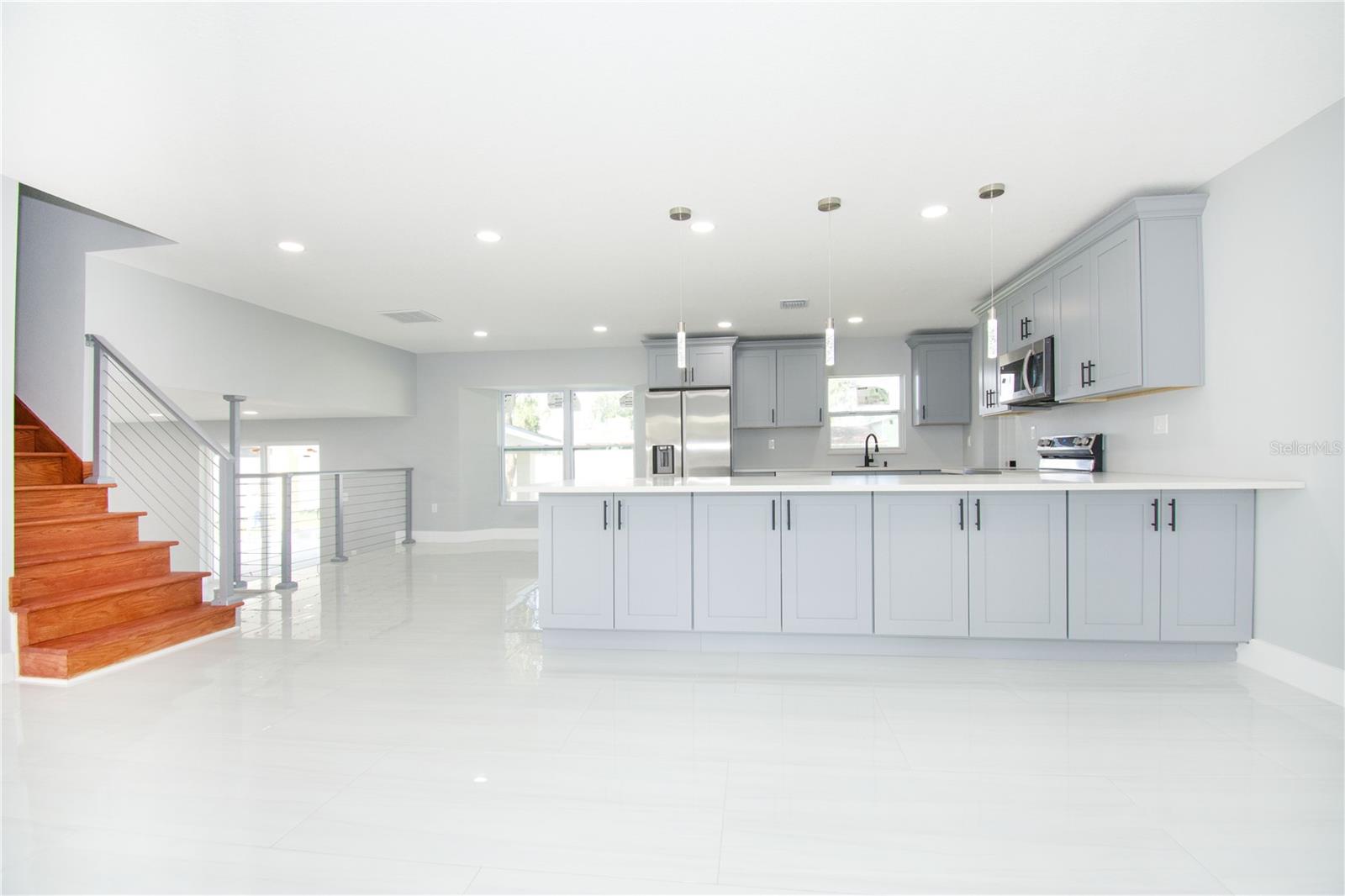 Modern Open- Concept Kitchen with Brand New Appliances and a Spacious Island