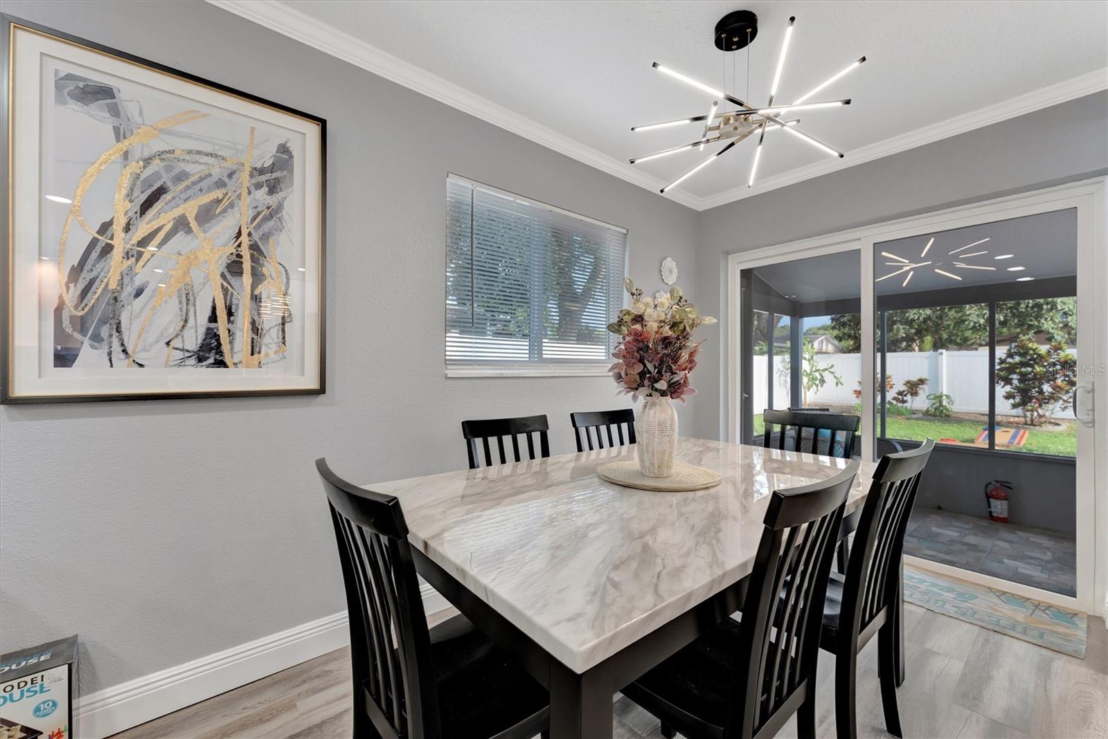 Dining rooms with sliders leading to back porch