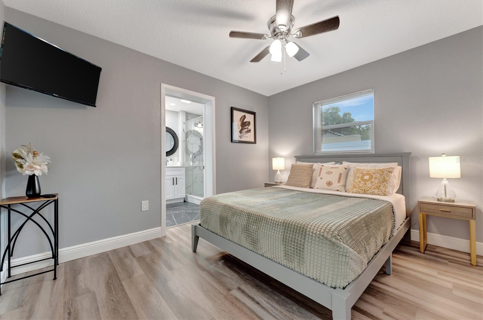 Primary bedroom is tastefully designed