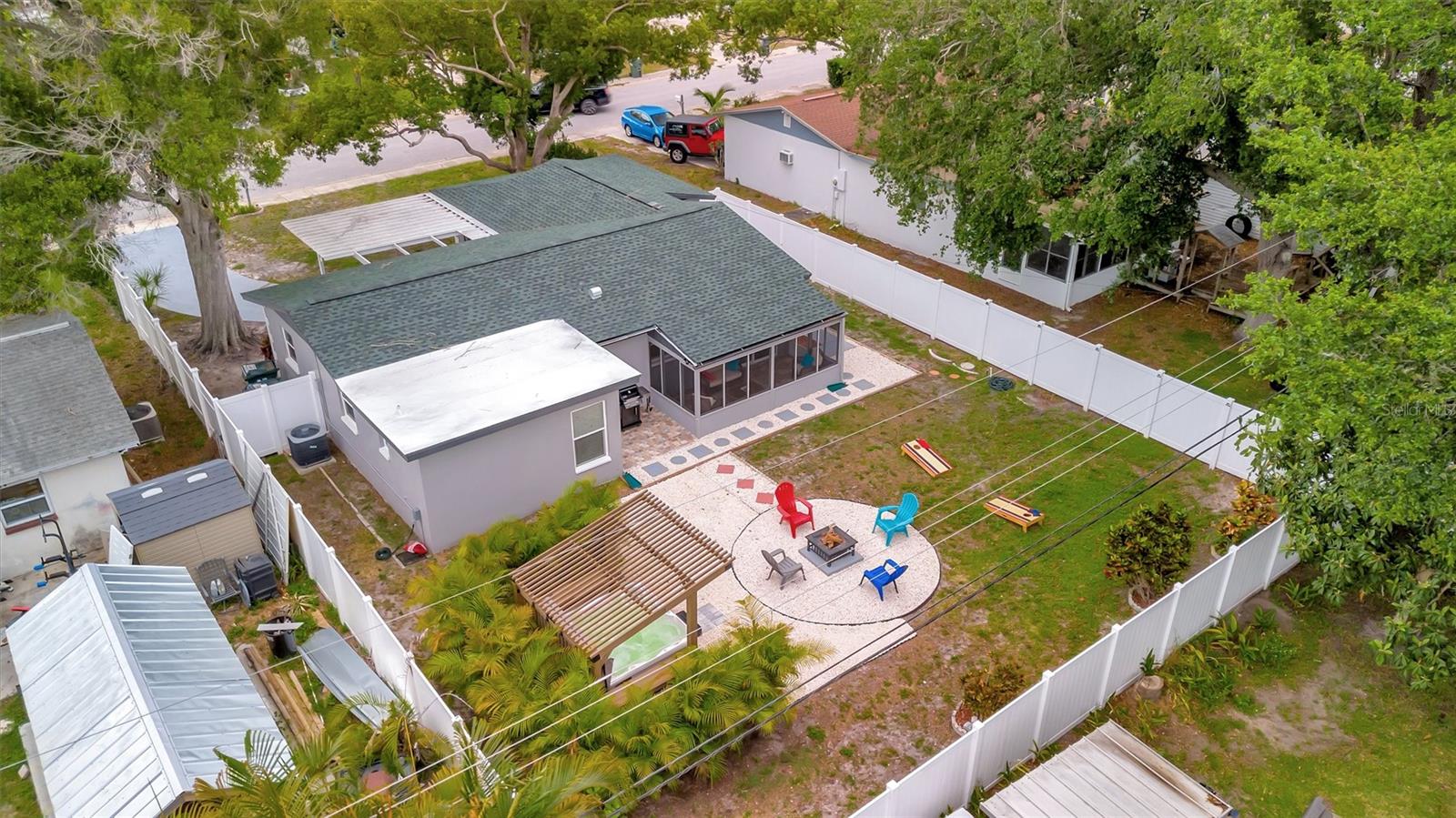 Backyard is fully fenced in with white vinyl fencing