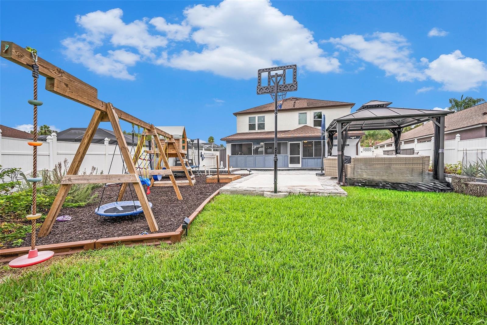 Playground Area with a fort on rubber mulch