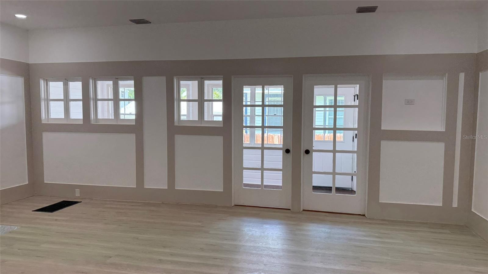 Beautiful great room... doors to rear sunroom.